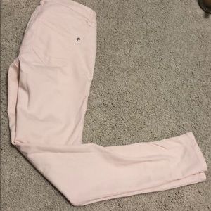 Pale pink skinny jeans